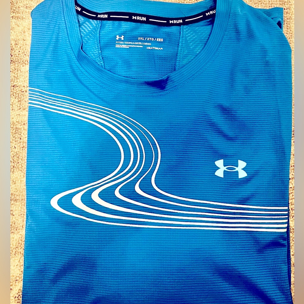 Men’s bright blue Under Armor Heat gear (keeps you cool)  short sleeve shirt
